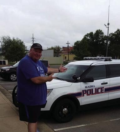 Donny Raley showing off one of the new Madill Police cruisers. Courtesy photo