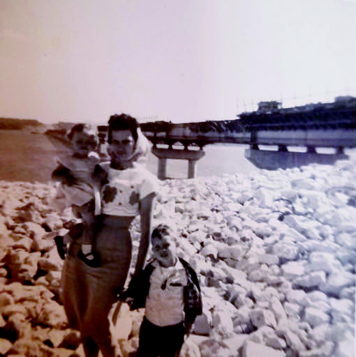 Hyahwahnah Cox is holding Brenda Cox Reeves, and standing next to Johnny Cox near the still unfinished old bridge in 1960. Johnny began working for ODOT when the new bridge was started and became the bridge inspector. Courtesy photo