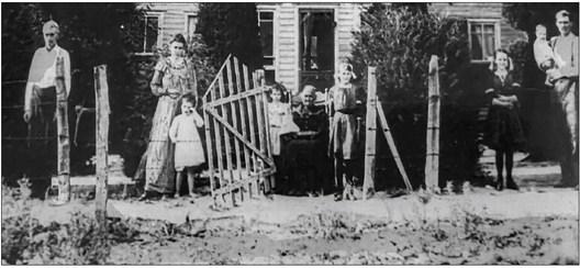 The Pettijohn family: Farm Hand, Nannie, Bertie, Osee, (Newton’s mother seated) Allis, Edna, Newton holding Callery Courtesy photo