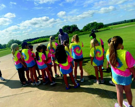 Courtesy photos The Madill Community Day Care students visited a Starbucks in Ardmore and the Chickasaw Pointe Golf Club.