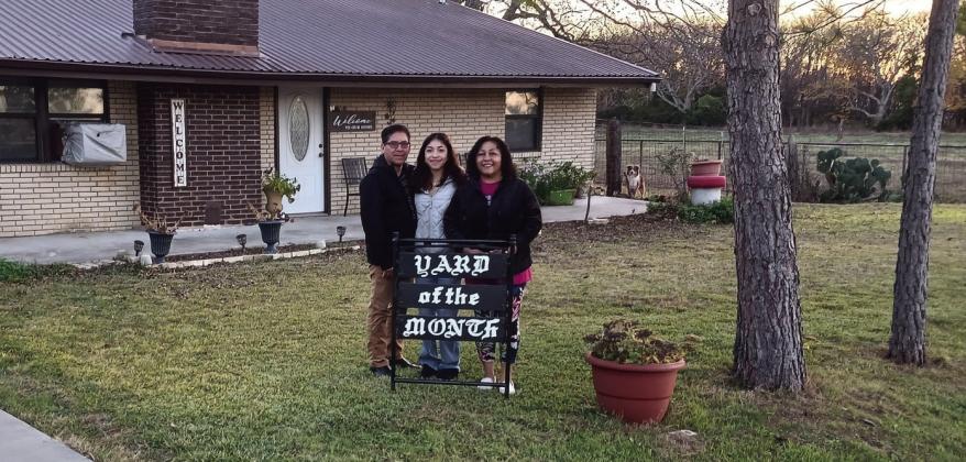 The Madill Rose Garden December Yard of the Month goes to Jorge and Sandra Valeriano and their daughter, Flower, on East Taliaferro Street. They have blooming rose bushes, pansies and mint. They have numerous desert plants that bloom in pink and some in violet. They even have some cacti. They have many young pine trees. Courtesy photo