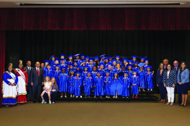 Chickasaw Nation Governor Bill Anoatubby, fourth from the left, is joined by Chickasaw Nation Education staff, elected officials and Chickasaw royalty to celebrate the graduation of Chickasaw Nation Head Start students in Ardmore. Courtesy photo