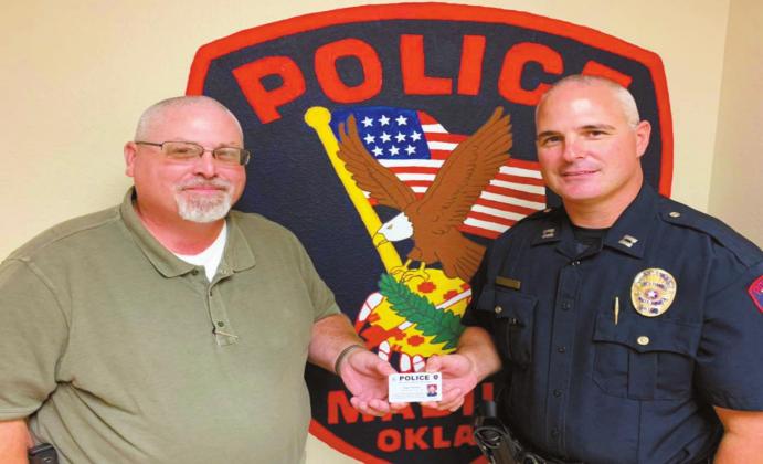 Courtesy photo On July 24, Chief of Police Donald Yow announced the promotion of Captain Steven Ray to the rank of Deputy Chief and presented him with a new commission card. Deputy Chief Ray will temporarily assume command of the police department as Chief Yow transitions to retirement from the Madill Police Department and into the role of Marshall County Sheriff.
