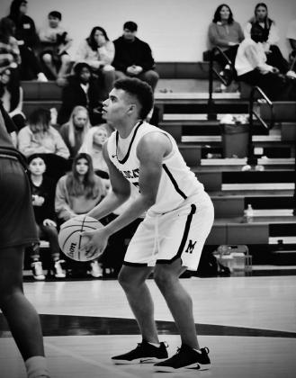 RJ Morris prepares to shoot a free throw during the Comet Holiday Classic. Bre Eppler