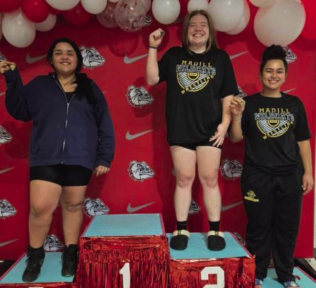 Madelyn Ritchie, middle, made school history when she became the first girl grappler to make it to regionals. Also pictured are Angelna Mendiola and Morgan Walls. Courtesy photo