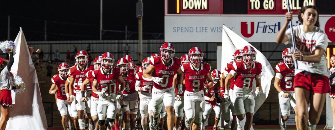 The Kingston Redskins make their grand entrance before the Kingston v. Sperry game. Kingston High School