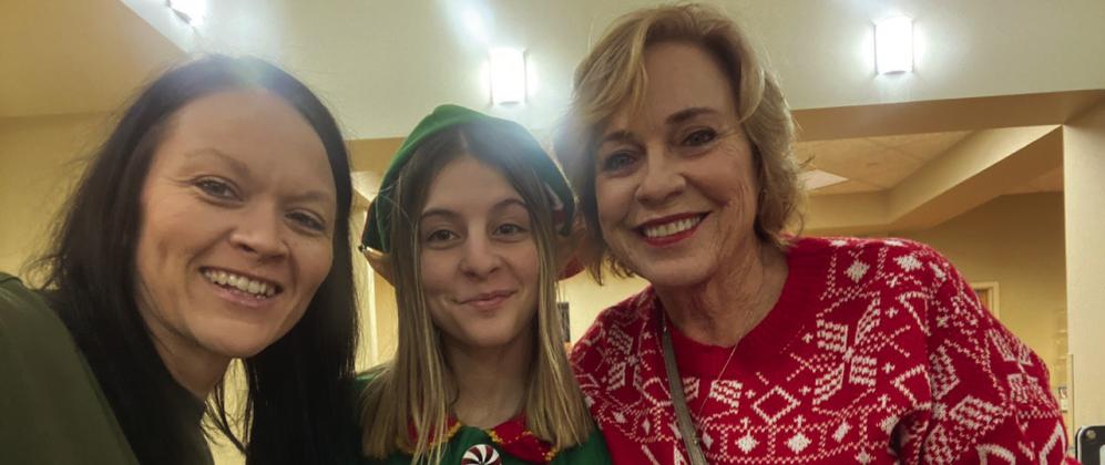Top photo: Summer Bryant, Kimber Gentis and Patti Sparlin pass out gifts at AllianceHealth Madill. Bottom photo: Gwen and David Wilson spread cheer on Christmas Eve. Courtesy photos