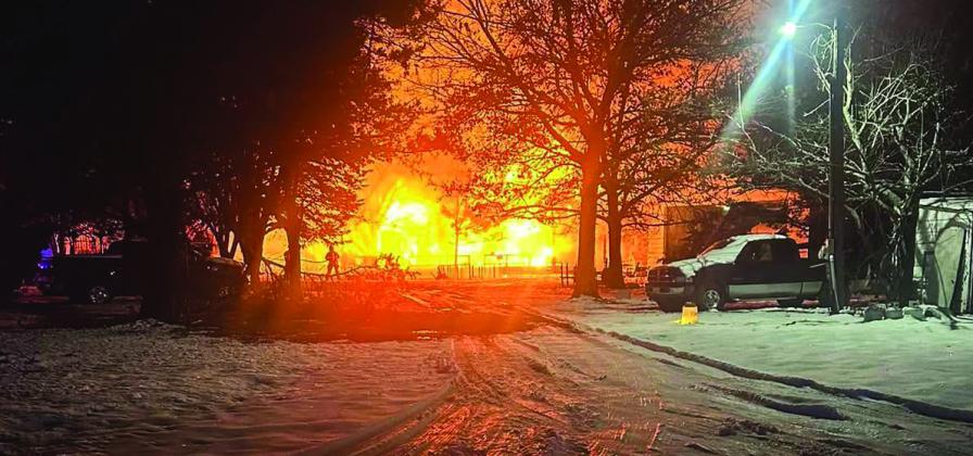 On January 12, a house on Rock Creek Road caught fire. The resident stated that she was awakened by her TV turning off, since she can't sleep without noise from her TV. She opened the door and her house was completely engulfed in flames. Luckily, she had a door to the outside in her bedroom and was able to get out safely. Courtesy photo