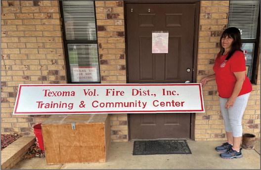 Shellie Blakely painted the new sign for the Texoma Fire Department Auxiliary. Courtesy photo