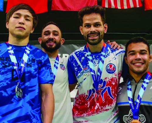 Peter Hammer atop the podium with the other medalists. From Left: Yelaman Amangeldy of Kazahkstan (Silver), Darian Cruz of Puerto Rico (Gold), Hammer of Costa Rica (Bronze), and Jacob Moran of Puerto Rico (Bronze). Courtesy photo