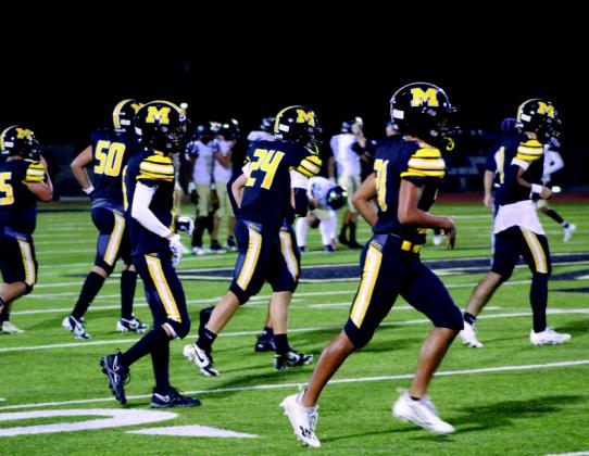 The Wildcats run onto the field during the Madill v. Marietta game on September 5. Photo courtesy of Bryant Photography
