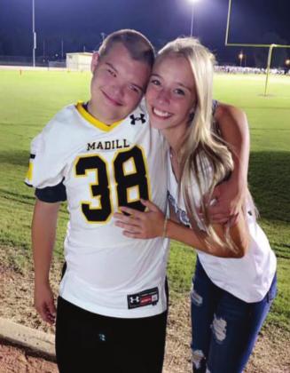Mason was all smiles with Emilie Johnson during the Madill v Tishomingo game on August 27, 2021. Summer Bryant • The Madill Record