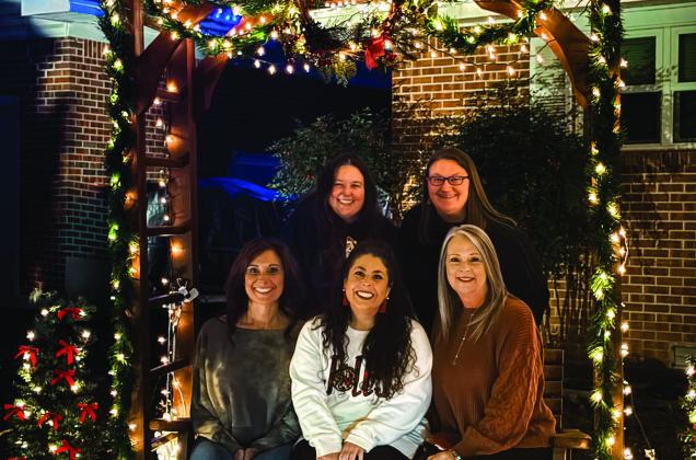 The Madill Beautification Committee held a Spread the Holiday Cheer contest. Pug Ugly, pictured left, won first place. Madill Daughters held their annual Christmas light contest. Coach Shaw and Lydia Faulkner Shaw, pictured right, won first place in that contest. Courtesy photos