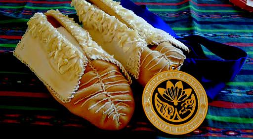 “Wedding Moccasins” won the regalia division of the Southeastern Art Show and Market. The art is deer hide, brain-tanned, with ornamental beading to highlight the more than 400 pieces of shell adorning each moccasin. Couresty photo