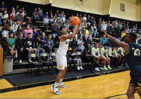 Dibbon Marris • For the Madill Record Madill sophomore Ezekiel Fuentes shoots a corner three pointer during the Wildcats’ 56-45 win over the Putnam Heights Panthers Dec. 5 at the Madill Winter Classic.
