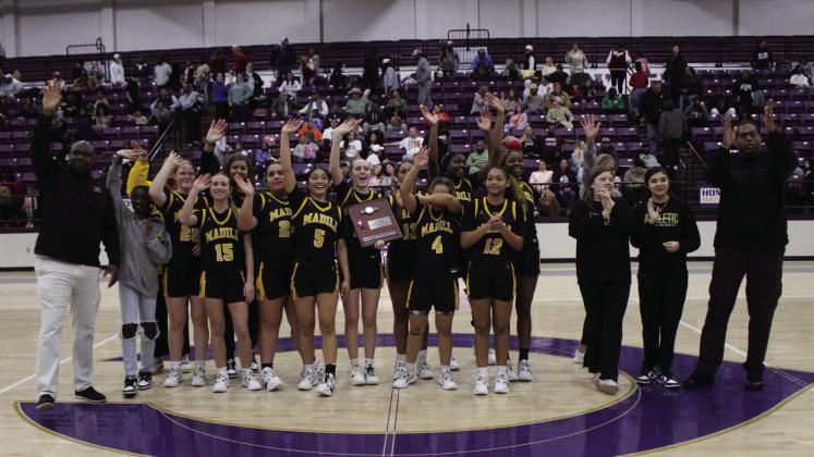 The Lady Wildcats celebrate their first trip to state tournament . Photo courtesy of Bryant Photography