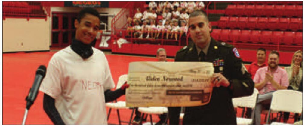 Sargent Jimenez from the Army presenting the scholarship to Aiden Norwood. Gary Jackson