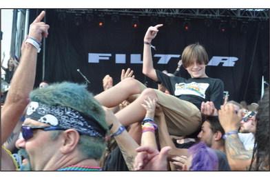 Many rock'n'roll fans enjoy crowdsurfing. Charles White