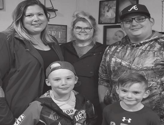 The Frazier family shown in their Galey, Oklahoma, home. Front row left to right: Maverick and Slade. Back left to right: Amber, Natalee and Tyler. Courtesy photo