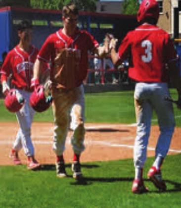 Klete Finley, Jase Hayes, and Bryant Watts congratulate each other after a good play during the playoffs. Courtesy photo