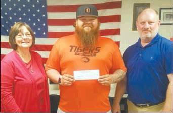Courtesy Photo Josh Sisco, center, receives a $1,000 national scholarship check from ECU Veterans Upward Bound staff Mary Meeks and John Engel.