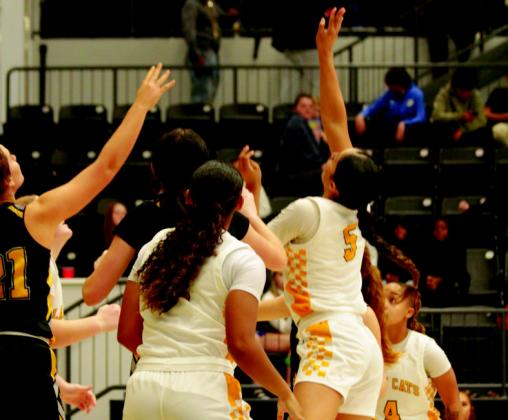 The MHS girls basketball team claim the Winter Classic consolation. Arlette Andrande jumps for the tip off. Summer Bryant
