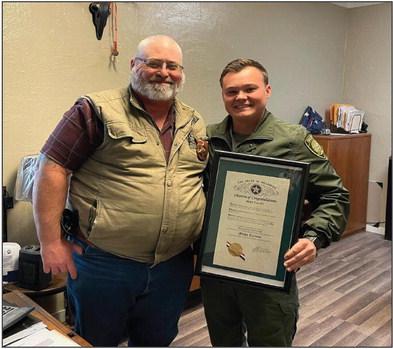 Marshall County Sheriff Donald Yow, left, presents Micah Current with the Deputy of the Year. Courtesy photo