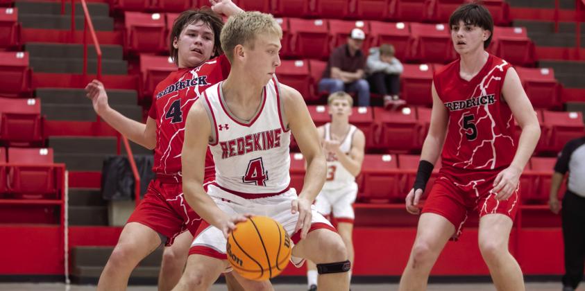 Ewan Weaver dribbles the ball down the court during the Kingston v Frederick game. Matt Swearengin