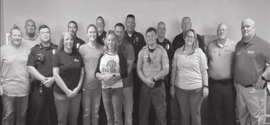 Summer Bryant • The Madill Record From left to right: Catherine Bennett, Deputy Bo Cobbs, Officer Uriel Barrientos, Donna Goates, Officer Gannon Reid, Christine Murray, Officer Anna Gerard, Misty Forbis, Rodney Forbis, Major Shannon Beshirs, Deputy Micah Current, Chief Steven Ray, Donny Raley, Rebecca Perkinson, Sheriff Donald Yow, and Undersheriff John Bridgeman.