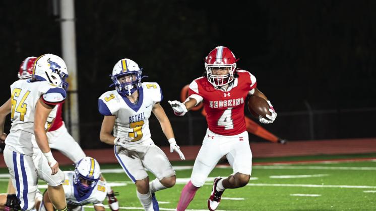 Kingston senior Blake Wise runs the ball down the field. Photo by Natalie Hawkins
