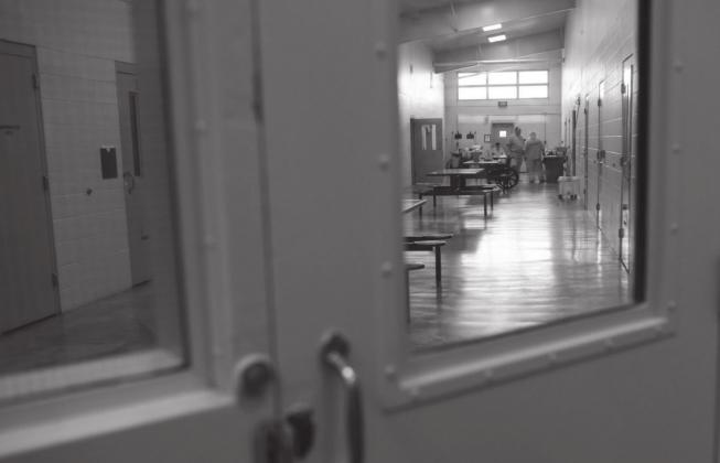 In this file photo, inmates gather in a common area outside of their cells at Joseph Harp Correctional Center in Lexington. Whitney Bryen/Oklahoma Watch