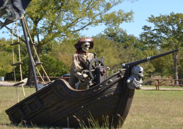 A pirate skeleton and a skeleton driving a hearse are a few of the things ready to greet anybody wishing to visit the McBride RV park. Jessie Pearson • The Madill Record