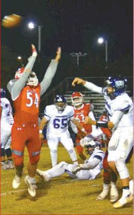 Lori Robinson • The Madill Record Junior Redskin Trenton Smith #54 gets in past the Coalgate line.