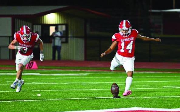 A KHS Redskin kicks the ball down the field. Kingston High School Media Class