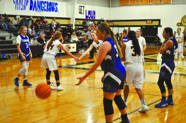 Two Madill players congratulate each other for a good play.
