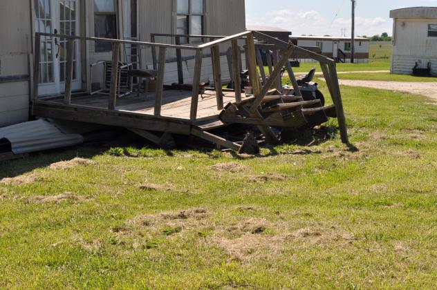 A house in the trailer park on Smiley Road received damage from the tornado. Photo by Charles White