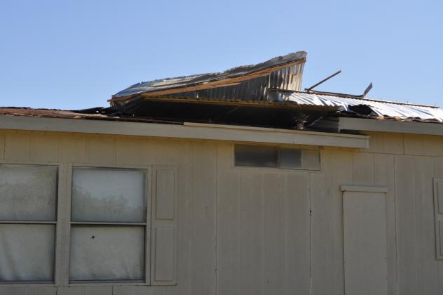 A house in the trailer park on Smiley Road received damage from the tornado. Photo by Charles White