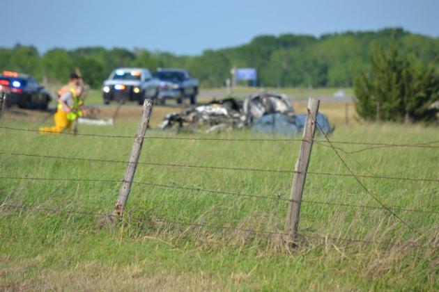 First responders rush to the scene where a vehicle was smashed from the tornado. Photo by Matt Caban