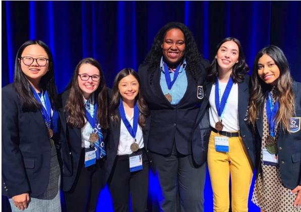 Edmond Santa Fe High School senior LaBraia Owens (third from right) is pictured with the other officers of DECA, a student organization that strives to prepare emerging leaders and entrepreneurs in marketing, finance, hospitality and management. (Photo provided by LaBraia Owens)