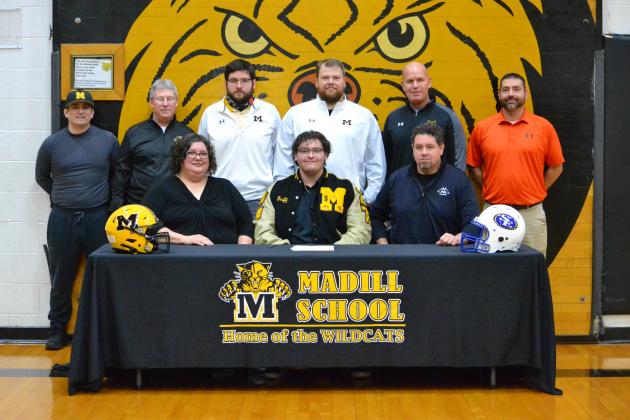 Group photo standing l-r: Madill Assistant Wrestling Coach Chris Turrobiartes, Madill Wrestling Head Coach Jim Love, Madill Assistant Wrestling Coach Austin Pettigrew, Madill Assistant Football Coach Josh Sisco, Madill Football Head Coach Chad Speer and Madill High School Principal Jason Ward. Front Row l-r: Shannon Williams, Griffon Williams and Joe Williams. Photo by Summer Bryant.