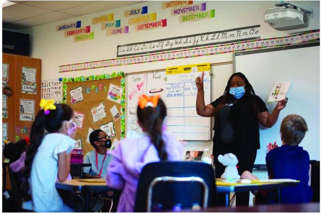 Quanetta Broom, a school counselor at Cesar Chavez Elementary School in Oklahoma City, read a book about emotions to second graders on June 16, 2021. (Whitney Bryen/Oklahoma Watch)