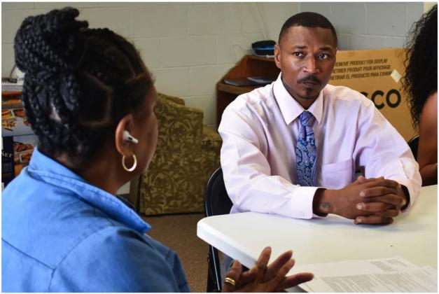 Charles Joe Edward Whiters, 41, listens to the family members of inmates complain about poor treatment in corrections facilities across the state. Whiters is a former inmate who now advocates for better treatment of prisoners and criminal justice reform through the Oklahoma Coalition Against People Abuse. (Rebecca Najera/Oklahoma Watch)