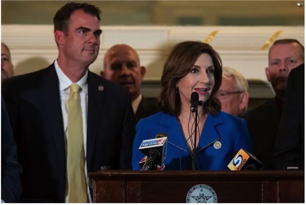 State Superintendent of Education Joy Hofmeister speaks about the state budget in the Blue Room at the State Capitol on May 15, 2019. Gov. Kevin Stitt is seen on her left. Whitney Bryen/Oklahoma Watch