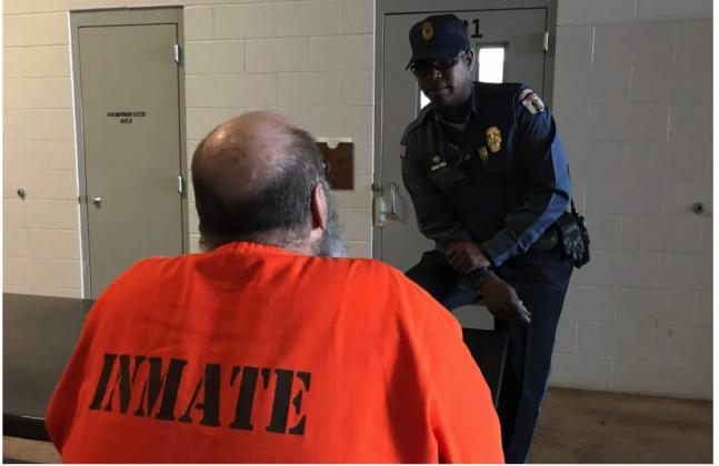Capt. Kory Conley speaks with an inmate at Joseph Harp Correctional Center in Lexington. (Courtesy Oklahoma Department of Corrections)
