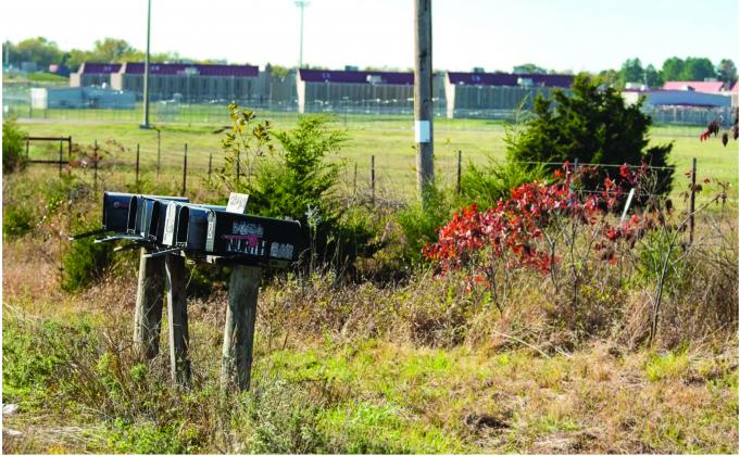 Across the street to the south, east and west of Davis Correctional Facility are homes to some of Holdenville's 5,459 residents. The town's census count includes inmates housed at the prison, which can accommodate up to 1,670 men. (Whitney Bryen/Oklahoma Watch)