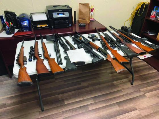 Deputies seized 17 firearms and over 7,000 rounds of ammo. One firearm was reported stolen from Kansas. (Courtesy photo)