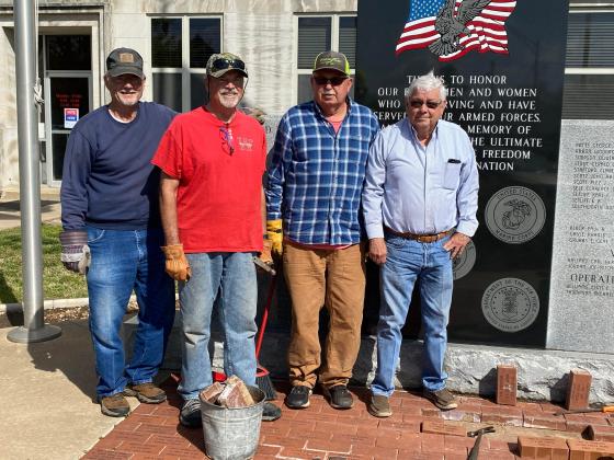 Richard Bonnet, Ron Frost, Bruce Paige and Thomas Herndon placed the 15 new bricks. (Summer Bryant)