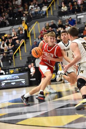 Brock Rumer, #11, and Brylan James, #1, go head to head during the Kingston v Madill game on December 5. (Crockett Uber)