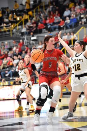 Jayda Foster, #12, dribbles past Haylee Elkins during the Kingston v Madill game. (Crockett Uber)