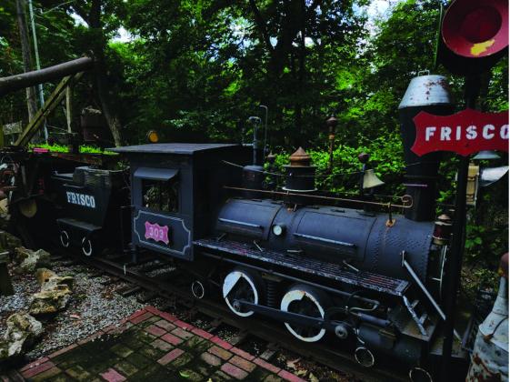 The yard consists of flowers, the "Flower Hotel" and a train. (Courtesy photo)